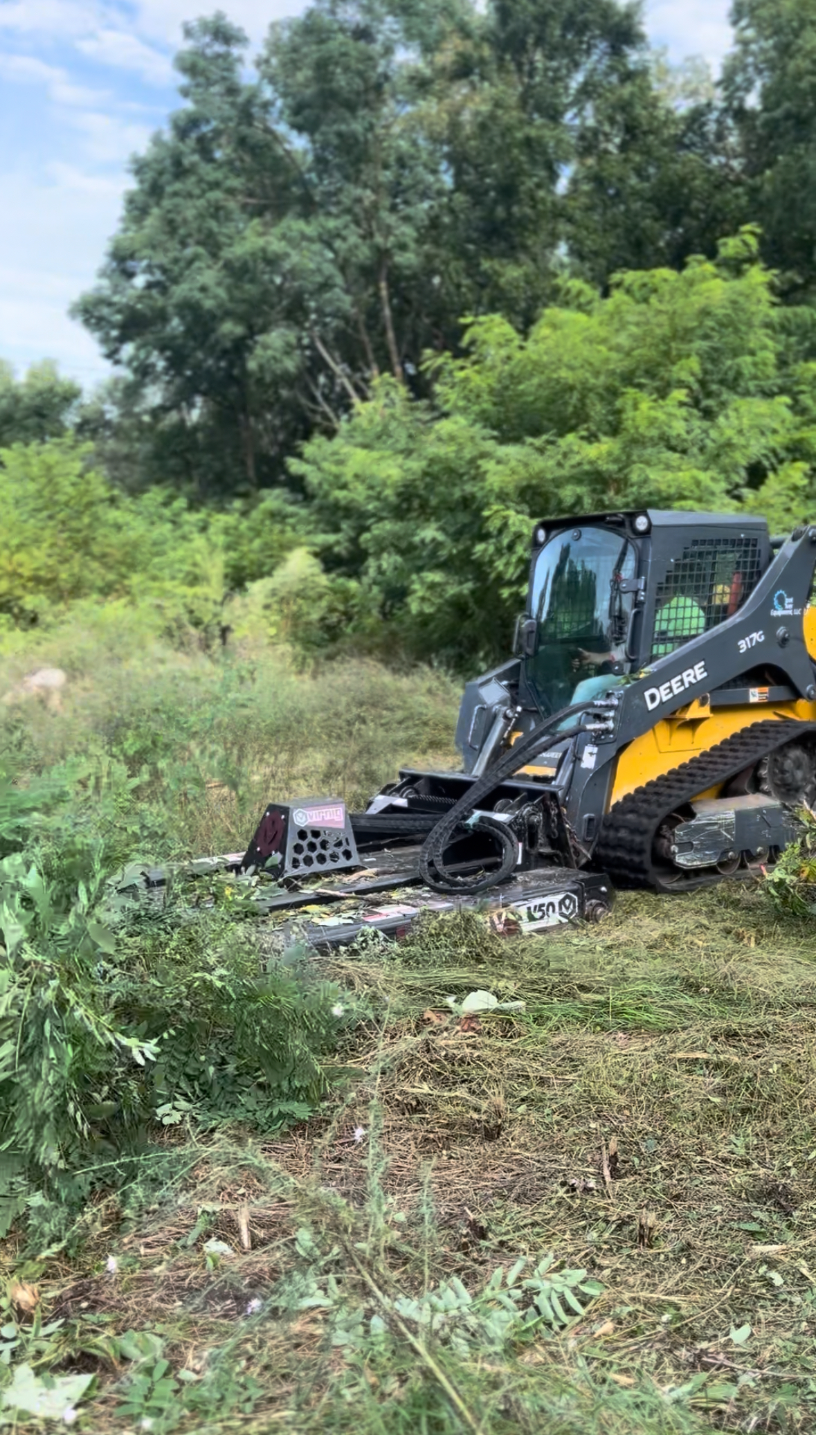 Professional land clearing equipment working on site preparation